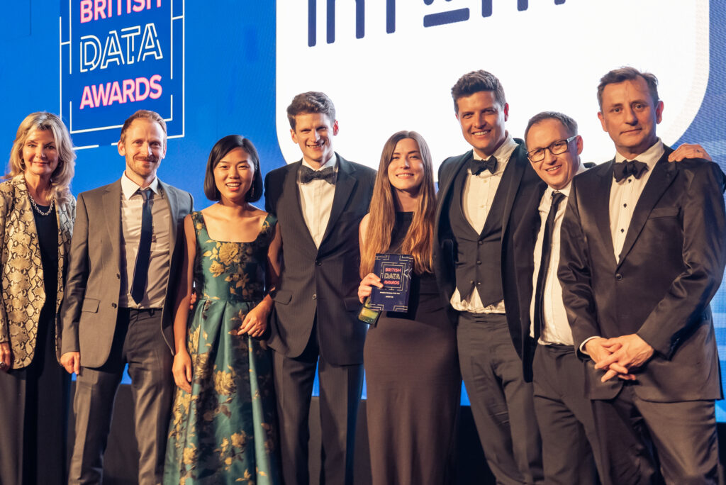 The Intent HQ team on stage at the British Data Awards 2025, holding the “Analytics Company of the Year” trophy after winning the award.